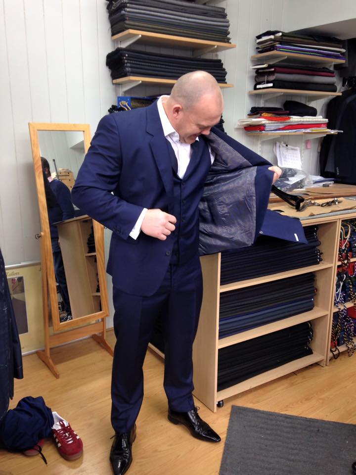steve looking at jacket lining finished